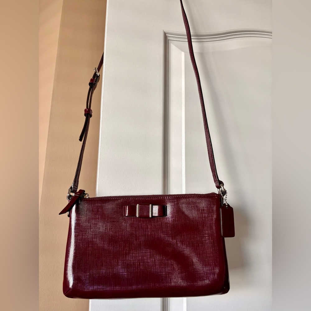 Coach Darcy Burgundy Patent Bow East West Swingpack crossbody bag